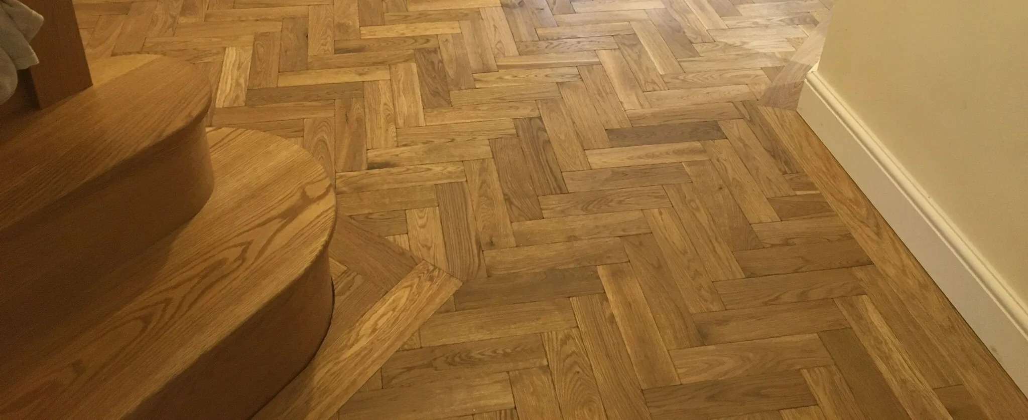 A finished herringbone parquet floor