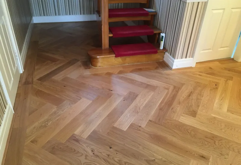 Herringbone parquet flooring in a hallway