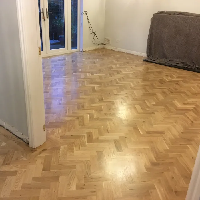 Restored herringbone parquet floor in a Wigan home