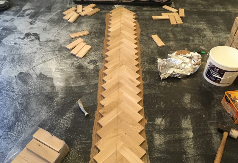 Herringbone parquet being set out